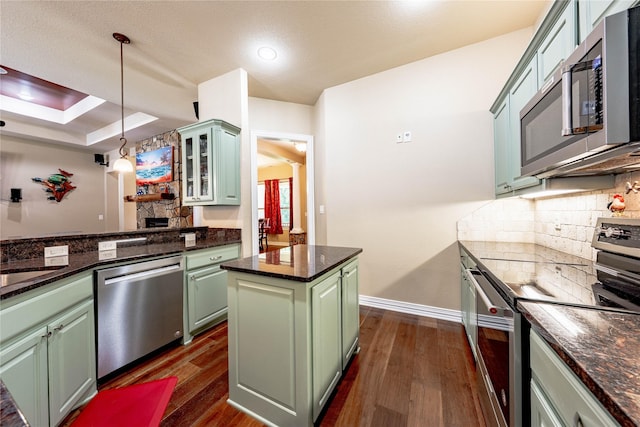 6296 Fm 1256, Mabank, TX 75147 - kitchen featuring appliances with stainless steel finishes, green cabinetry, dark wood-style flooring, tasteful backsplash, and recessed lighting