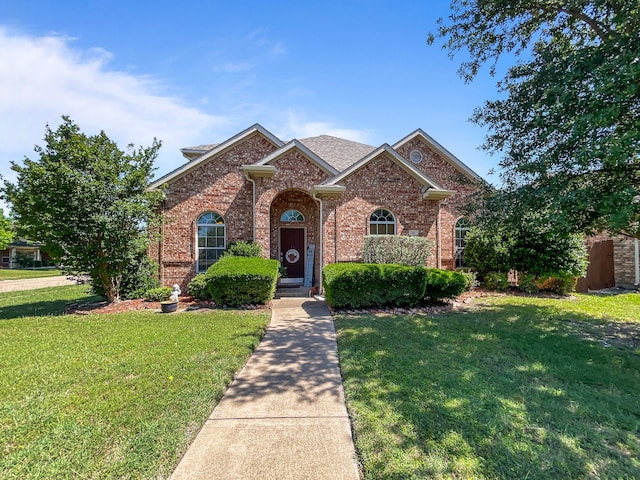 301 Quail Run Rd, Red Oak, TX 75154 - view of front of home with brick siding and a front yard