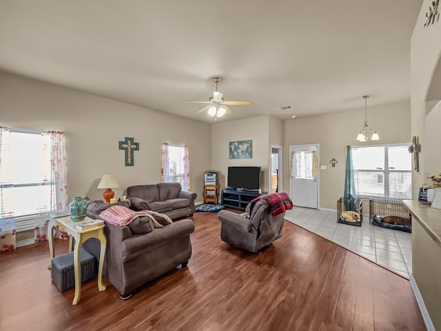 301 Quail Run Rd, Red Oak, TX 75154 - living area with wood finished floors, plenty of natural light, a ceiling fan, and a chandelier