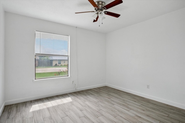 5409 Queens Ct, Lake Dallas, TX 75065 - unfurnished room featuring wood finished floors, a ceiling fan, and baseboards