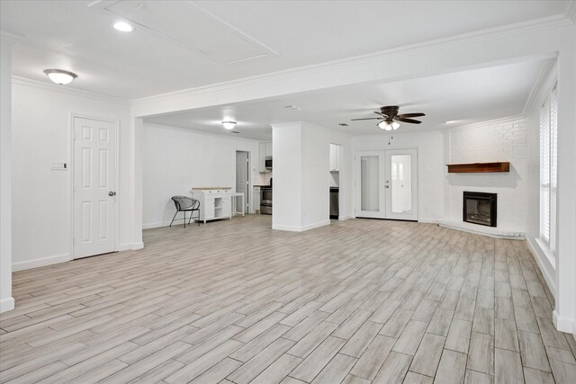 5409 Queens Ct, Lake Dallas, TX 75065 - unfurnished living room with a fireplace, light wood finished floors, baseboards, ceiling fan, and ornamental molding