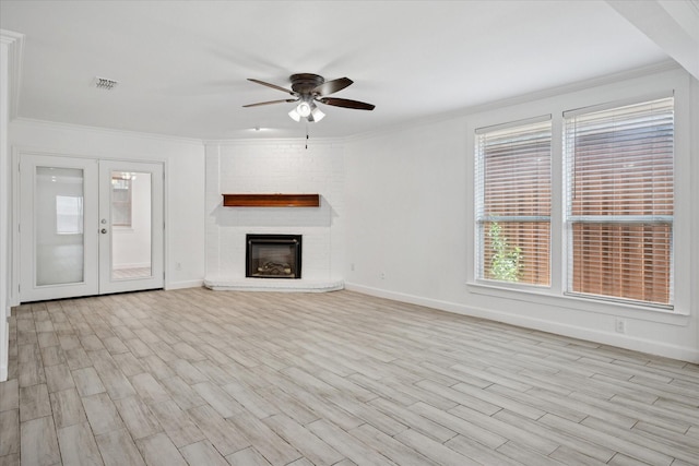 5409 Queens Ct, Lake Dallas, TX 75065 - unfurnished living room featuring ornamental molding, ceiling fan, wood finished floors, baseboards, and a brick fireplace