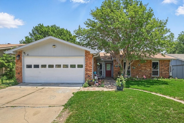 7028 Whitewood Dr, Fort Worth, TX 76137 - single story home featuring brick siding, driveway, a front lawn, and a garage