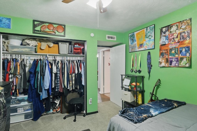 7028 Whitewood Dr, Fort Worth, TX 76137 - bedroom with a closet, carpet floors, a textured ceiling, and a ceiling fan