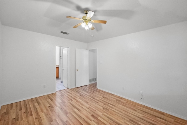 415 Blueberry Hill Ln, Mansfield, TX 76063 - unfurnished bedroom with light wood-style flooring, baseboards, connected bathroom, and ceiling fan