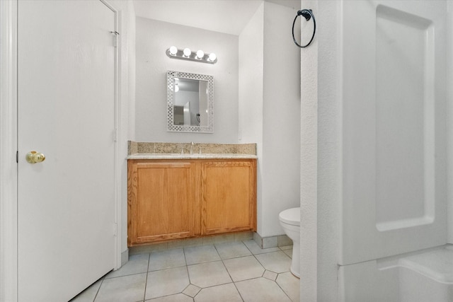 415 Blueberry Hill Ln, Mansfield, TX 76063 - bathroom with toilet, vanity, and tile patterned flooring