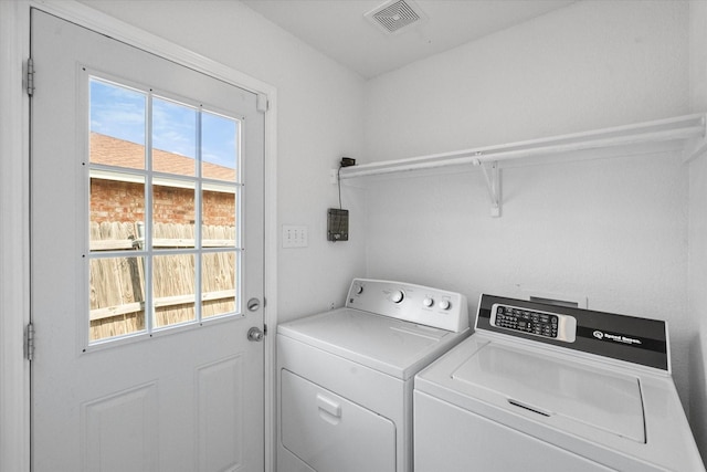 415 Blueberry Hill Ln, Mansfield, TX 76063 - laundry area with washing machine and clothes dryer and plenty of natural light