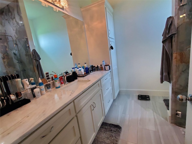 291 County Road 4833, Leonard, TX 75452 - bathroom featuring vanity, a marble finish shower, baseboards, and marble finish flooring