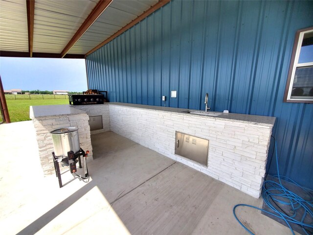 291 County Road 4833, Leonard, TX 75452 - view of patio featuring a sink and area for grilling