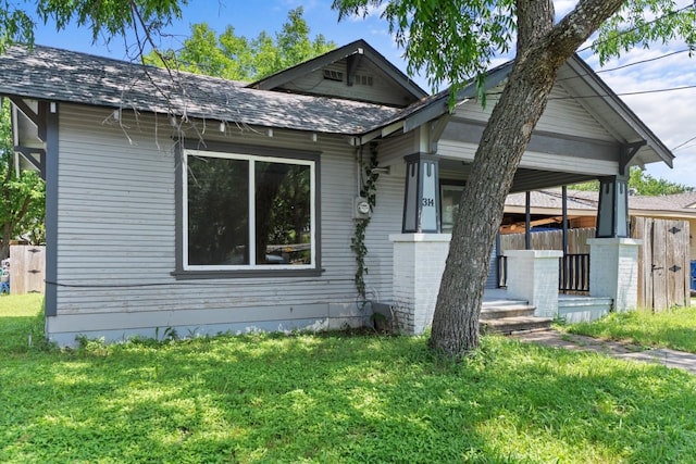314 Dunn St, Waxahachie, TX 75165 - view of front of house with a front lawn, a porch, and roof with shingles