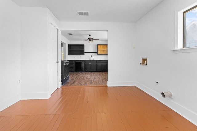 314 Dunn St, Waxahachie, TX 75165 - laundry area featuring hookup for an electric dryer, ceiling fan, hookup for a washing machine, and baseboards
