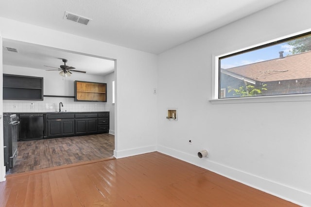 314 Dunn St, Waxahachie, TX 75165 - washroom featuring hardwood / wood-style floors, baseboards, electric dryer hookup, a ceiling fan, and washer hookup