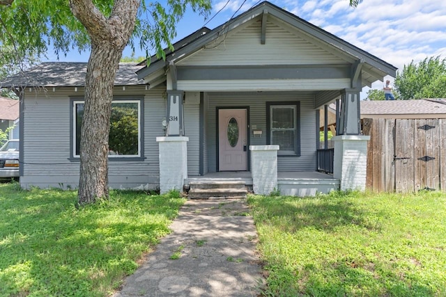 314 Dunn St, Waxahachie, TX 75165 - view of front of house with a porch and a front lawn