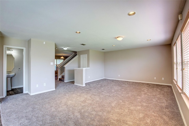 1057 Castle Top Dr, Fort Worth, TX 76052 - empty room with carpet floors, stairway, recessed lighting, baseboards, and a sink