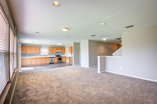 1057 Castle Top Dr, Fort Worth, TX 76052 - unfurnished living room featuring carpet floors, baseboards, and recessed lighting