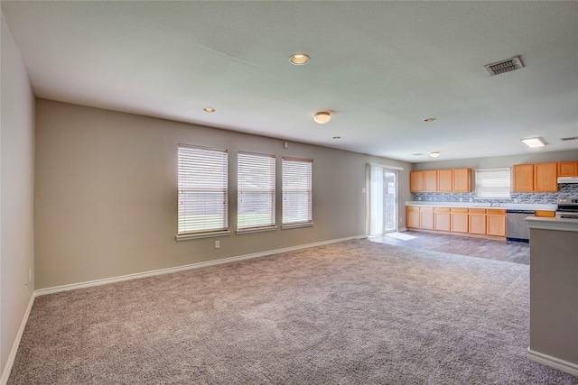 1057 Castle Top Dr, Fort Worth, TX 76052 - unfurnished living room featuring light colored carpet, baseboards, healthy amount of natural light, and recessed lighting