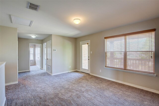 1057 Castle Top Dr, Fort Worth, TX 76052 - empty room featuring carpet flooring, baseboards, and attic access