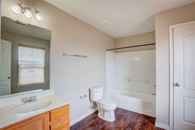 1057 Castle Top Dr, Fort Worth, TX 76052 - bathroom featuring wood finished floors, vanity, toilet, shower / bath combination, and baseboards