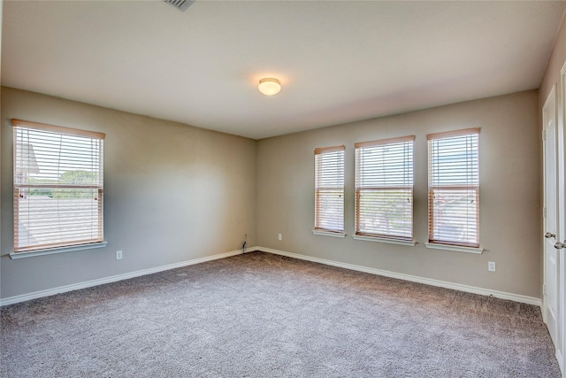 1057 Castle Top Dr, Fort Worth, TX 76052 - carpeted empty room featuring healthy amount of natural light and baseboards