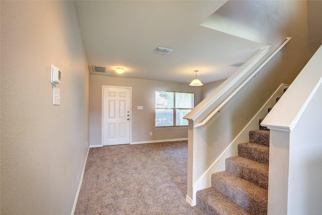 1057 Castle Top Dr, Fort Worth, TX 76052 - carpeted foyer with stairway and baseboards