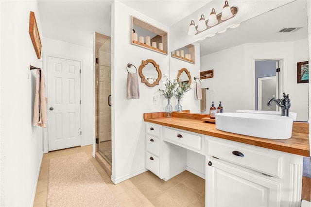 121 Sanchez Creek Ct, Weatherford, TX 76088 - full bathroom featuring tile patterned floors, vanity, a shower stall, and baseboards