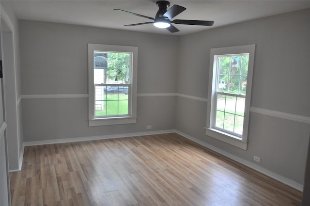 722 Sunset St, Sulphur Springs, TX 75482 - spare room featuring wood finished floors, a ceiling fan, and baseboards