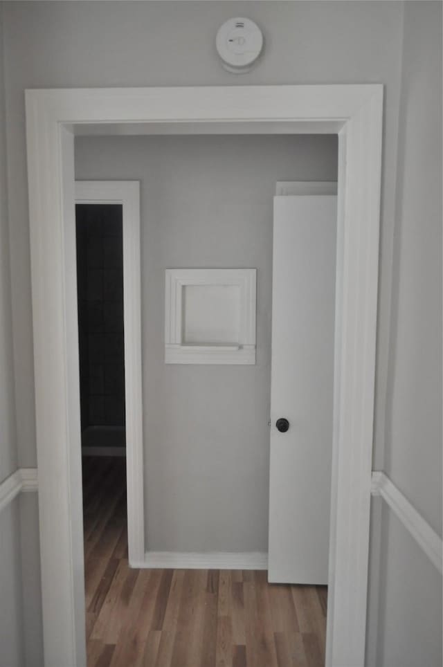 722 Sunset St, Sulphur Springs, TX 75482 - hallway with wood finished floors and baseboards