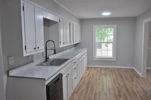 722 Sunset St, Sulphur Springs, TX 75482 - kitchen featuring a sink, dishwashing machine, light wood finished floors, baseboards, and white cabinetry