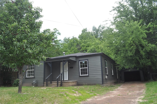 722 Sunset St, Sulphur Springs, TX 75482 - bungalow-style house featuring driveway, an outdoor structure, covered porch, and a garage