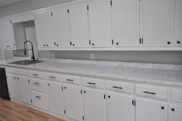 722 Sunset St, Sulphur Springs, TX 75482 - kitchen with a sink, white cabinets, light wood-style flooring, and dishwasher