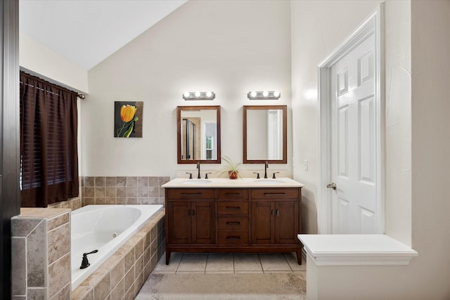 8405 Circleview St, Rowlett, TX 75088 - bathroom with a bath, double vanity, tile patterned flooring, and high vaulted ceiling