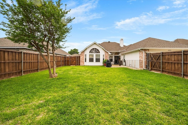 8405 Circleview St, Rowlett, TX 75088 - rear view of house featuring brick siding, a chimney, and a shingled roof