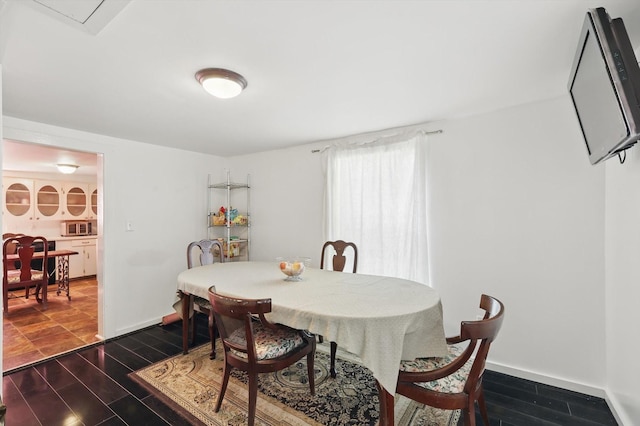 116 S Lyndalyn Ave, Desoto, TX 75115 - dining area with wood finish floors and baseboards