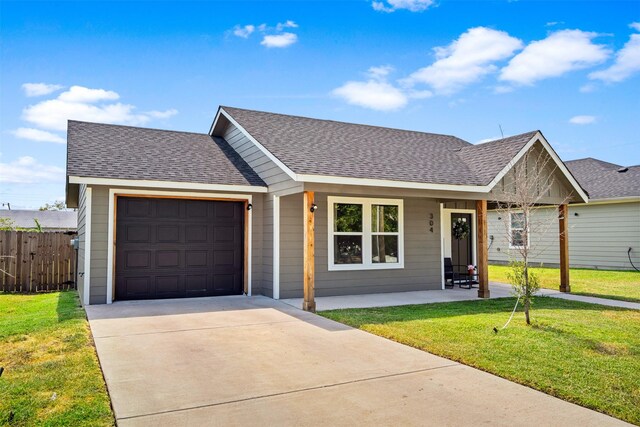 304 Thomas St, Terrell, TX 75160 - view of front of home featuring a shingled roof, concrete driveway, a garage, and a porch
