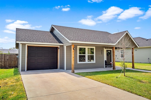 304 Thomas St, Terrell, TX 75160 - view of front of property featuring a shingled roof, driveway, a garage, and covered porch