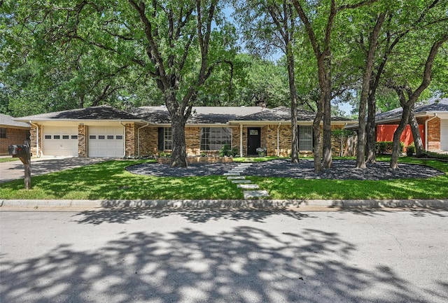 2009 Botts Dr, Arlington, TX 76012 - view of front of home with a garage, driveway, a front lawn, brick siding, and a chimney