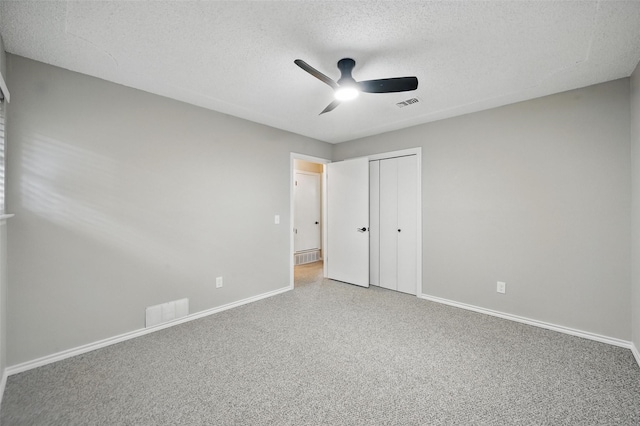 2009 Botts Dr, Arlington, TX 76012 - unfurnished bedroom featuring a textured ceiling, baseboards, a closet, and ceiling fan