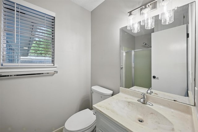 2009 Botts Dr, Arlington, TX 76012 - bathroom with a shower with shower door, toilet, and vanity