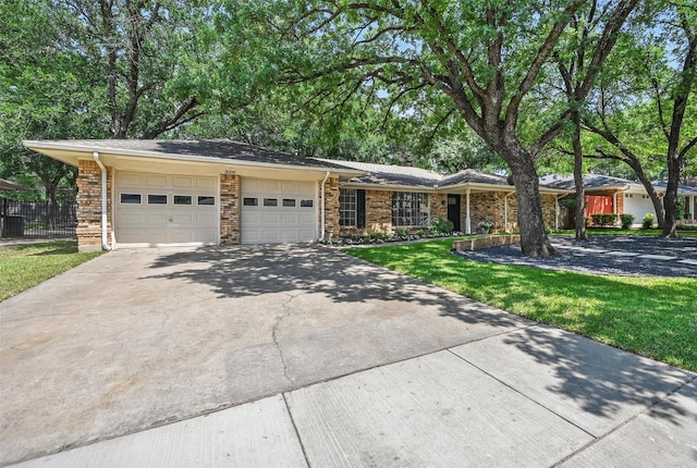 2009 Botts Dr, Arlington, TX 76012 - view of front of house featuring a garage and driveway