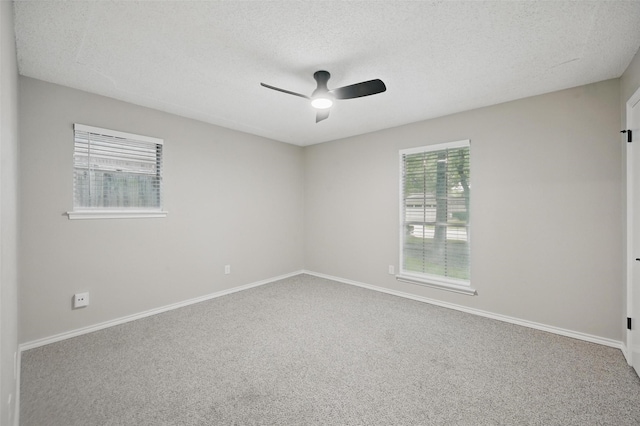 2009 Botts Dr, Arlington, TX 76012 - spare room featuring ceiling fan, carpet flooring, a textured ceiling, and baseboards