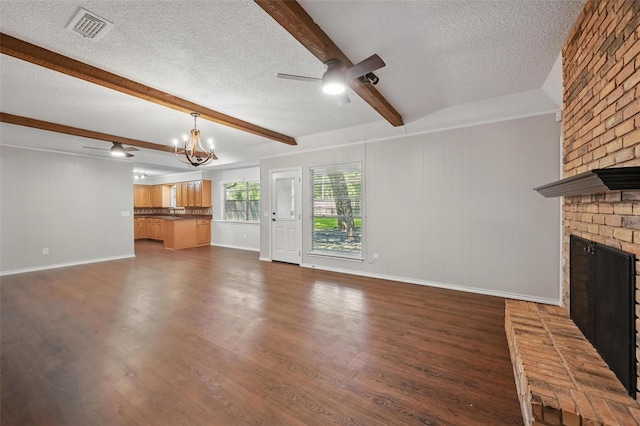 2009 Botts Dr, Arlington, TX 76012 - unfurnished living room featuring a textured ceiling, ceiling fan, a brick fireplace, beam ceiling, and dark wood-type flooring