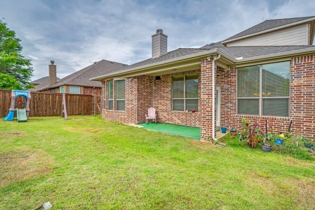 1420 Candler Dr, Prosper, TX 75078 - rear view of property with brick siding and a chimney