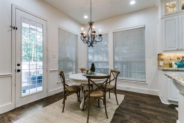 2219 Graystone Ct, Keller, TX 76248 - dining room with a chandelier, dark wood-style flooring, recessed lighting, and baseboards