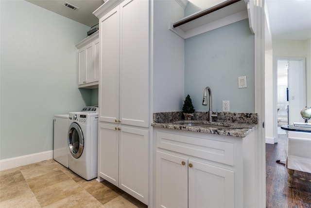2219 Graystone Ct, Keller, TX 76248 - laundry room featuring washer and dryer, cabinet space, and baseboards