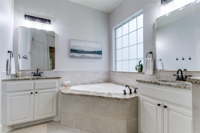 2219 Graystone Ct, Keller, TX 76248 - bathroom with two vanities, a bath, and tile patterned floors