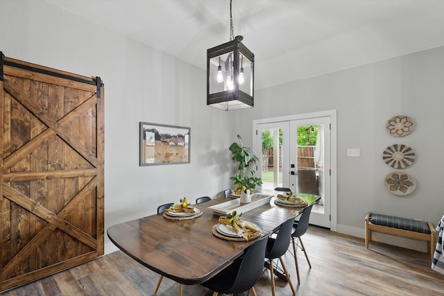 3964 Hunter Peak Rd, Fort Worth, TX 76262 - dining space with wood finished floors, french doors, baseboards, and a barn door