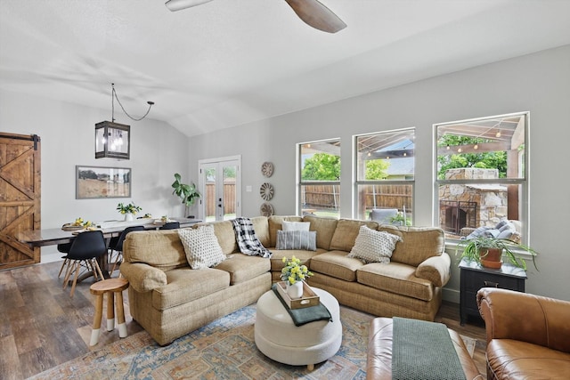 3964 Hunter Peak Rd, Fort Worth, TX 76262 - living area featuring a barn door, wood finished floors, vaulted ceiling, ceiling fan, and french doors