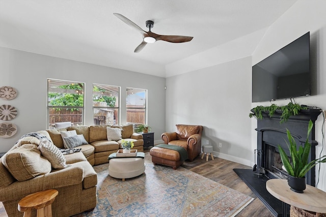 3964 Hunter Peak Rd, Fort Worth, TX 76262 - living area with a ceiling fan, wood finished floors, a glass covered fireplace, baseboards, and lofted ceiling