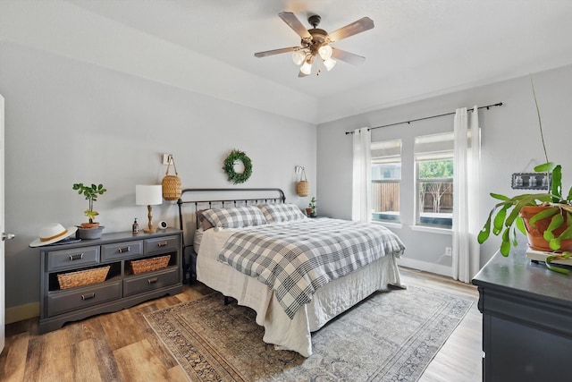 3964 Hunter Peak Rd, Fort Worth, TX 76262 - bedroom featuring wood finished floors, a ceiling fan, and baseboards