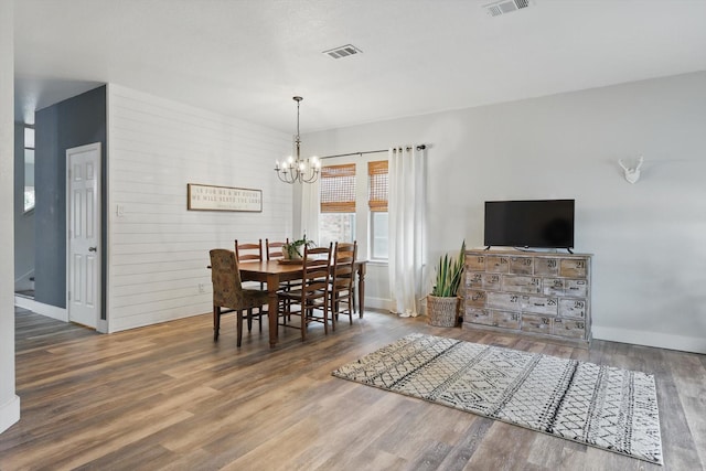 3964 Hunter Peak Rd, Fort Worth, TX 76262 - dining room featuring a chandelier, wood finished floors, and baseboards